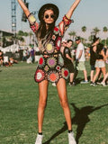 A model in a Colorful Long Sleeves Mini Dress Cover-Ups Swimwear with sunglasses, posing at an outdoor festival.
