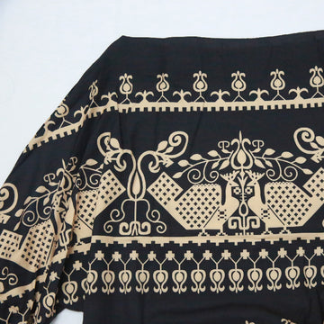 Off Shoulder Geometric Print Puff Sleeve Top featuring a black and beige geometric design.